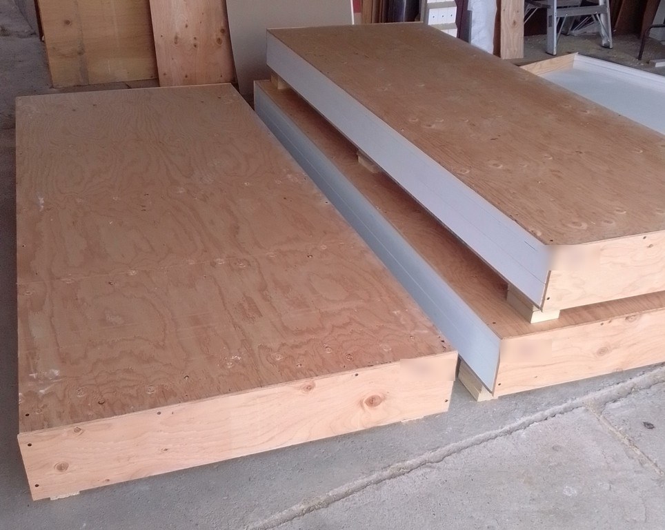 Heavy-duty wooden shipping crates with plywood tops and blocking, built by Pacific Crate